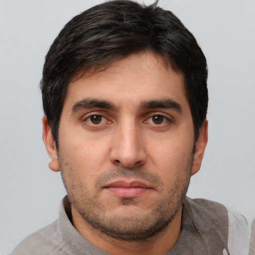 Neutral white young-adult male with short  black hair and brown eyes