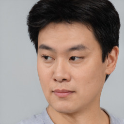 Neutral asian young-adult male with short  black hair and brown eyes