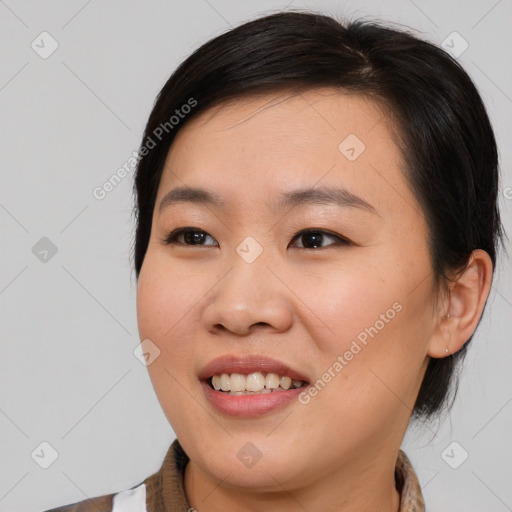 Joyful asian young-adult female with medium  brown hair and brown eyes