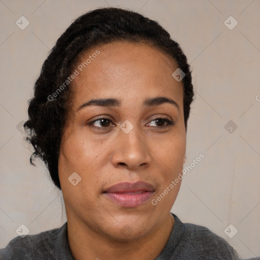 Joyful black adult female with short  black hair and brown eyes