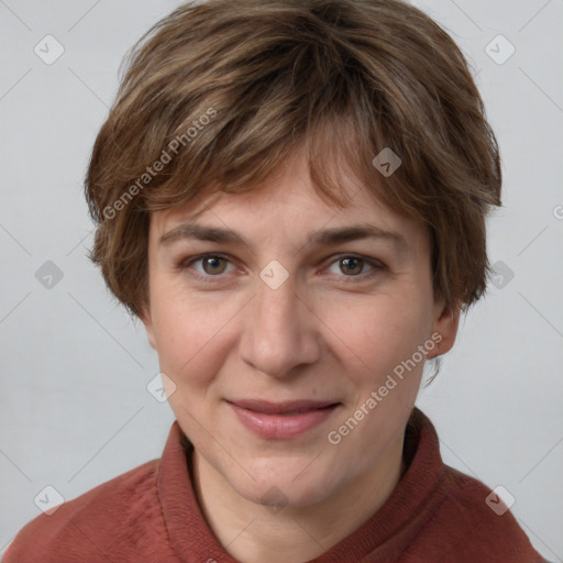 Joyful white adult female with short  brown hair and grey eyes