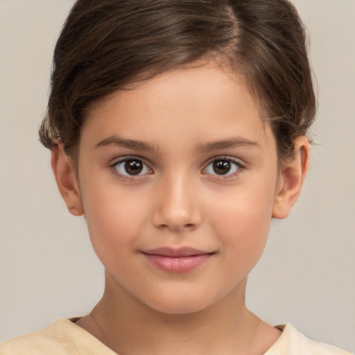 Joyful white child female with short  brown hair and brown eyes