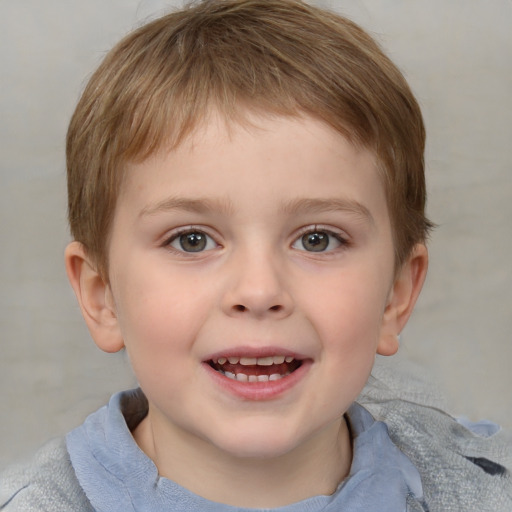 Joyful white child male with short  brown hair and grey eyes