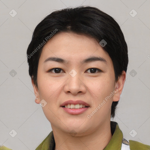 Joyful asian young-adult female with short  black hair and brown eyes