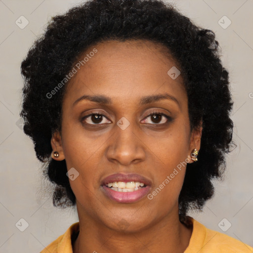 Joyful black young-adult female with long  brown hair and brown eyes