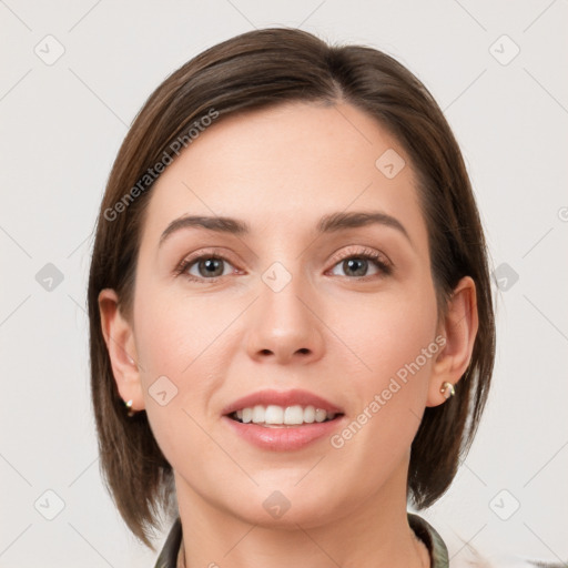 Joyful white young-adult female with medium  brown hair and grey eyes