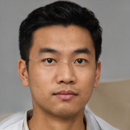 Neutral asian young-adult male with short  black hair and brown eyes