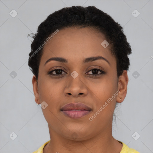 Joyful black young-adult female with short  brown hair and brown eyes