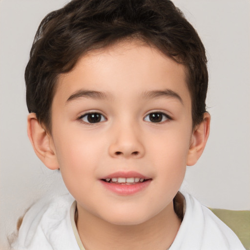 Joyful white child male with short  brown hair and brown eyes