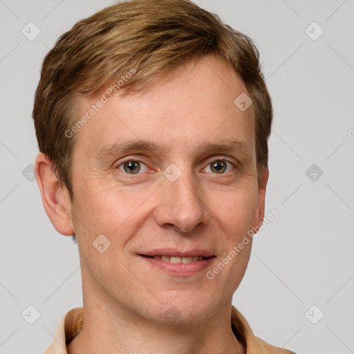 Joyful white adult male with short  brown hair and grey eyes