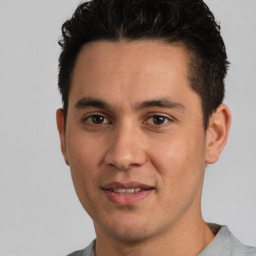 Joyful white young-adult male with short  black hair and brown eyes