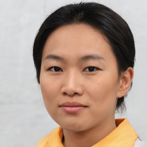 Neutral asian young-adult female with short  brown hair and brown eyes