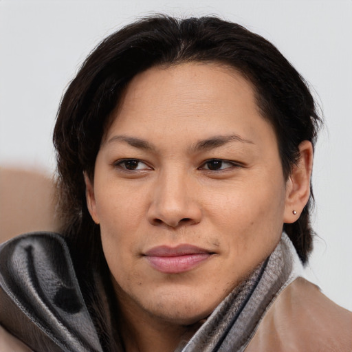 Joyful asian adult female with medium  brown hair and brown eyes