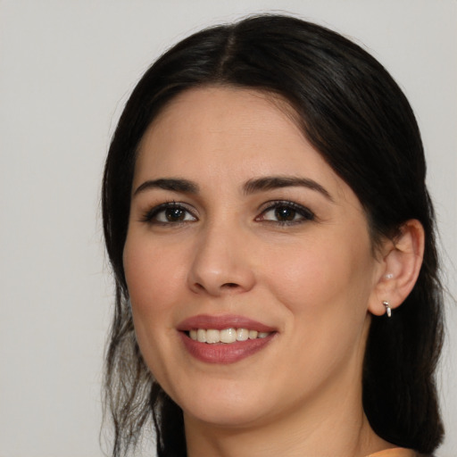 Joyful white young-adult female with medium  brown hair and brown eyes