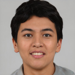 Joyful asian young-adult male with short  black hair and brown eyes