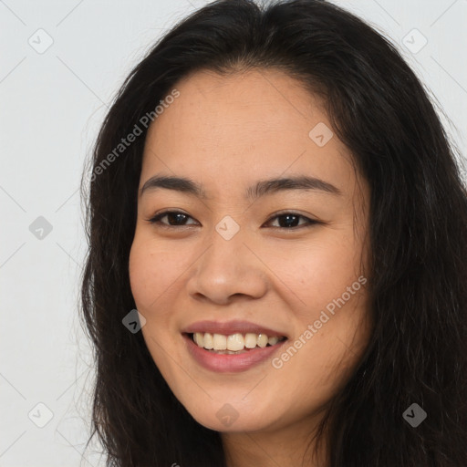 Joyful asian young-adult female with long  brown hair and brown eyes