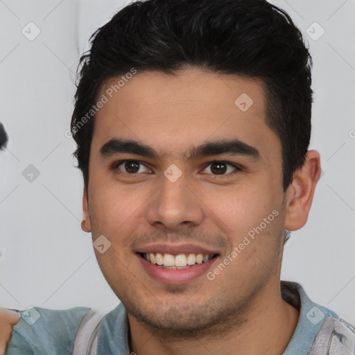 Joyful latino young-adult male with short  brown hair and brown eyes