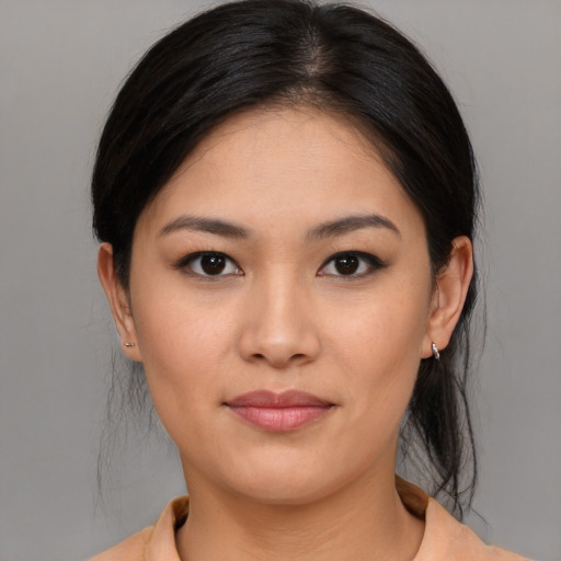 Joyful asian young-adult female with medium  brown hair and brown eyes