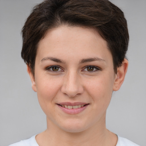 Joyful white young-adult female with short  brown hair and brown eyes