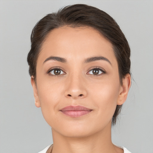 Joyful white young-adult female with medium  brown hair and brown eyes