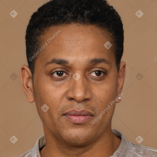 Joyful latino young-adult male with short  brown hair and brown eyes