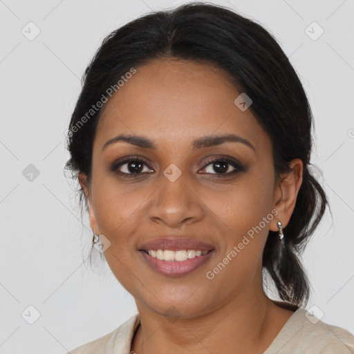 Joyful black young-adult female with medium  brown hair and brown eyes