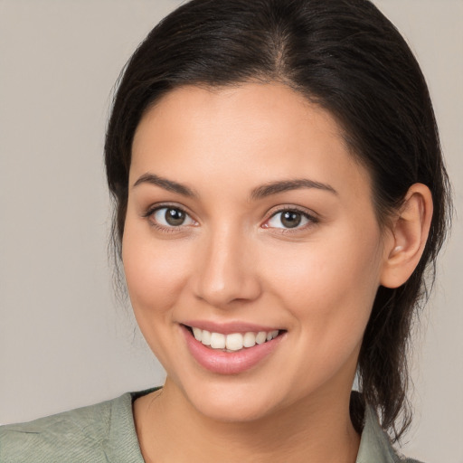 Joyful white young-adult female with medium  brown hair and brown eyes