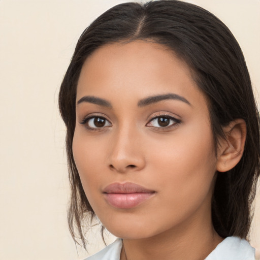 Neutral latino young-adult female with medium  brown hair and brown eyes