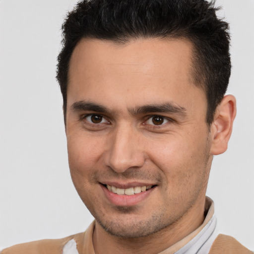 Joyful white young-adult male with short  brown hair and brown eyes