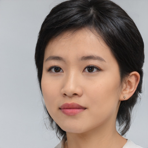 Neutral asian young-adult female with medium  black hair and brown eyes