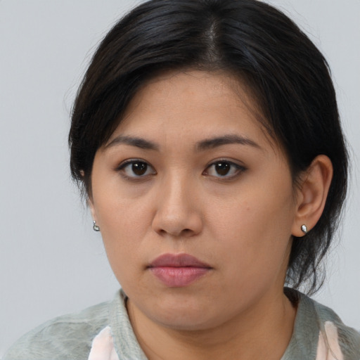 Neutral asian young-adult female with medium  brown hair and brown eyes