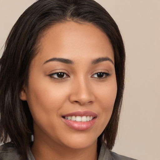 Joyful white young-adult female with medium  brown hair and brown eyes