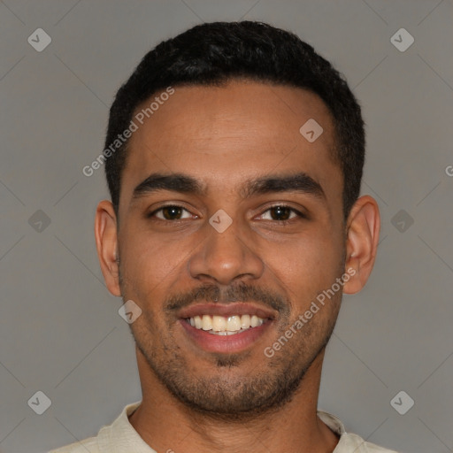 Joyful black young-adult male with short  black hair and brown eyes