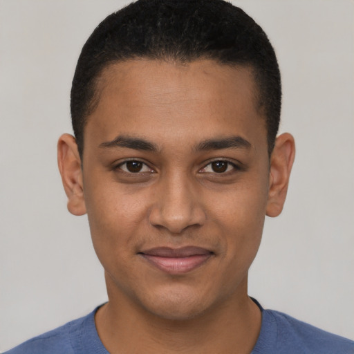 Joyful black young-adult male with short  black hair and brown eyes