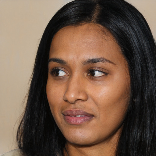 Joyful asian young-adult female with long  black hair and brown eyes