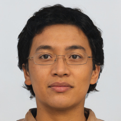 Joyful asian adult male with short  brown hair and brown eyes