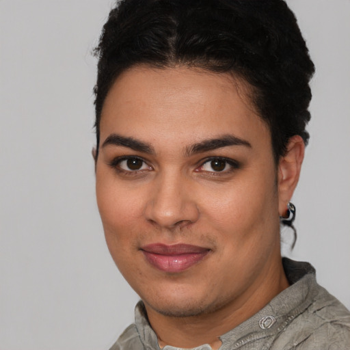 Joyful latino young-adult female with short  brown hair and brown eyes