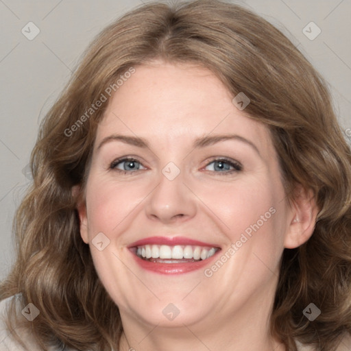 Joyful white adult female with medium  brown hair and grey eyes