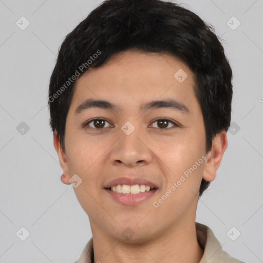 Joyful asian young-adult male with short  black hair and brown eyes