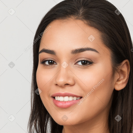 Joyful white young-adult female with long  brown hair and brown eyes