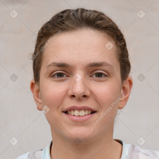 Joyful white young-adult female with short  brown hair and grey eyes