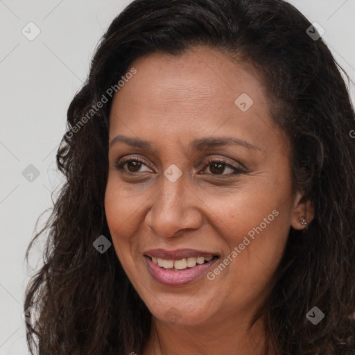 Joyful white adult female with long  brown hair and brown eyes