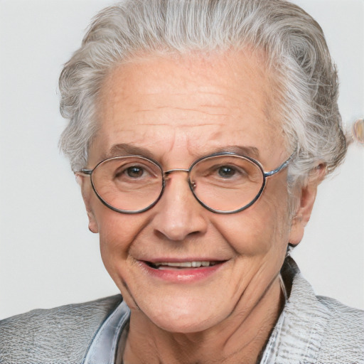 Joyful white middle-aged male with short  gray hair and blue eyes