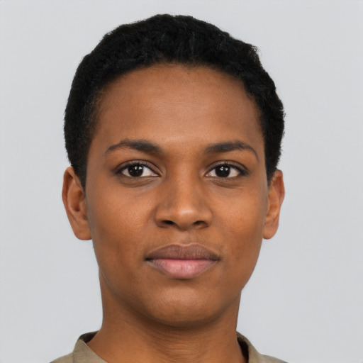 Joyful black young-adult female with short  black hair and brown eyes