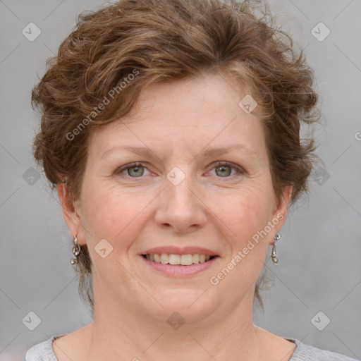 Joyful white adult female with medium  brown hair and blue eyes