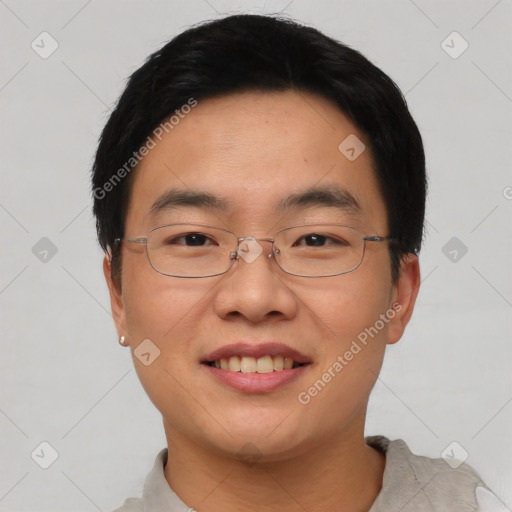 Joyful asian young-adult male with short  black hair and brown eyes