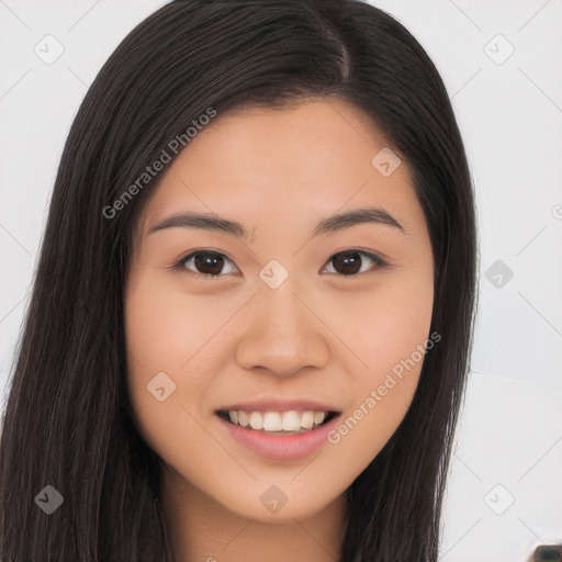 Joyful asian young-adult female with long  brown hair and brown eyes