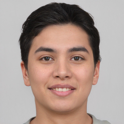 Joyful asian young-adult male with short  brown hair and brown eyes