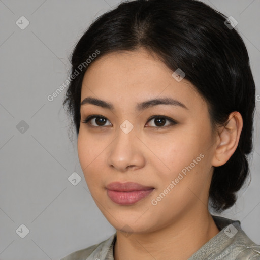 Joyful asian young-adult female with medium  black hair and brown eyes