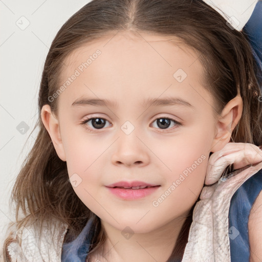 Joyful white child female with medium  brown hair and brown eyes